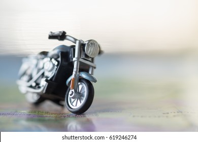 Travel Concept. Close up of motorcycle toy on map with copy space
