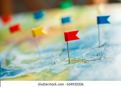 Travel concept with flag pushpins and world map