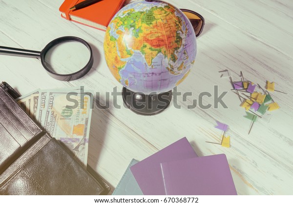Travel\
concept. Globe, money preparing for a\
trip