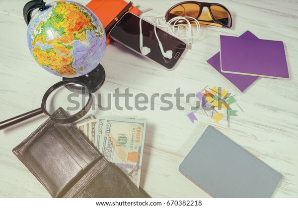 Travel\
concept. Globe, money preparing for a\
trip