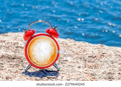 Travel concept. Good Morning, alarm clock with coffee on sea background - Shutterstock ID 2279644245