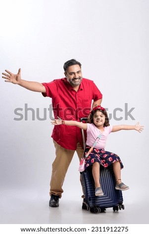 Travel concept : indian father with her daughter giving flying expression on white background.
