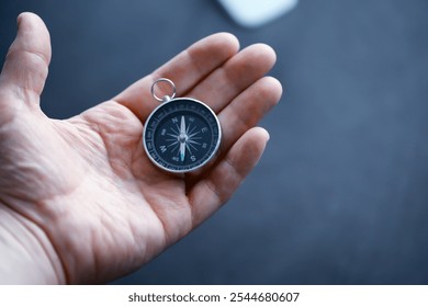 Travel concept. Magnetic compass in the hand. Retro navigator in hand map and airplane background. Adventure Background. - Powered by Shutterstock