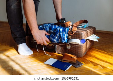 Travel Concept Man Put Stuff Suitcase Stock Photo (Edit Now) 1065991631