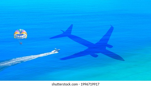 Travel Concept - An Passenger Airplane Shadow Flying Towards A Tropical Oludeniz Beach - Happy People Parasailing On Oludeniz Beach In Summer - Fethiye, Turkey