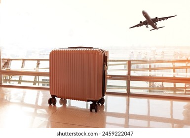 Travel concept with pink luggage as hat in the airport terminal waiting area, summer vacation concept, traveling and enjoying concept - Powered by Shutterstock