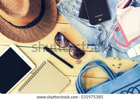 travel concept. set of women's accessories seen from above with free text space. summer holiday. over light and retro tone