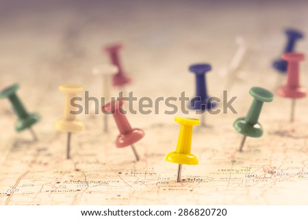 Travel concept with several pushpins on map,color filter effect
