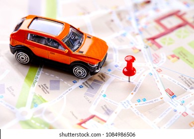 Travel Concept - Small Toy Car On The Map