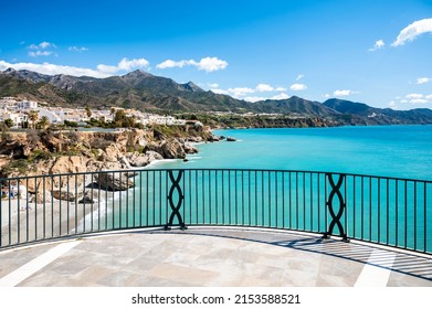 Travel destination, view on blue sea and mountains from Balcon de Europa in small Andalusian town Nerja with white houses and narrow streets on Costa del Sol, Spain in spring