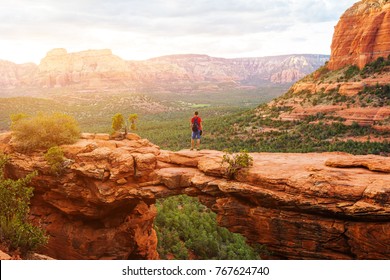 Travel in Devil's Bridge Trail, man Hiker with backpack enjoying view, Sedona, Arizona, USA - Powered by Shutterstock