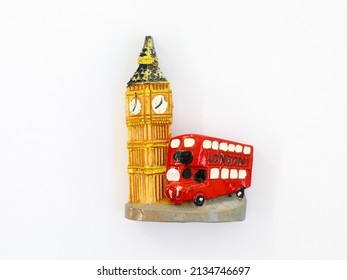 Travel in England UK concept. Red London double decker bus with word LONDON and Big Ben tower. Classic british landmark icon as magnet isolated on white background. Top view flat lay close up