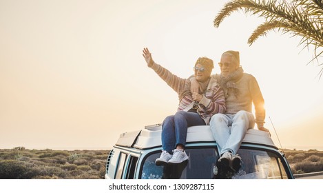 Travel And Enjoying Life Lifestyle In Love For Couple In Relationship Sitting On The Roof Of A Old Vintage Romantic Van With Sunset And Sunlight Golden Tones Background - Forever Together