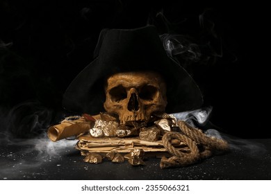 Travel equipment with golden nuggets, human skull, old manuscripts and pirate hat on black background