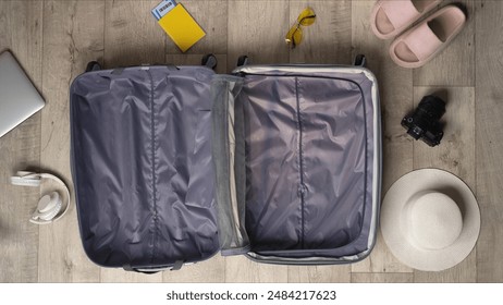 Travel Essentials Neatly Arranged Around Open Suitcase - Powered by Shutterstock