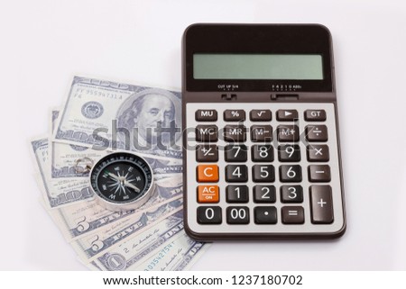 Travel & Exploration Concept : Compass Notebank and coin with Notebook and Calulator