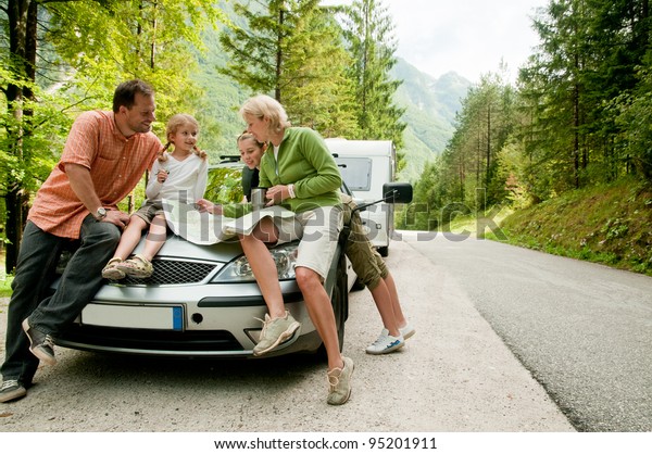 Travel - family\
with camping car on the\
road