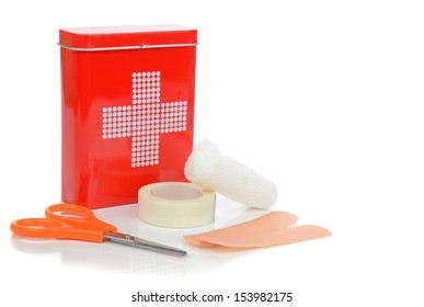 A Travel First Aid Kit Tin With Contents On A White Background