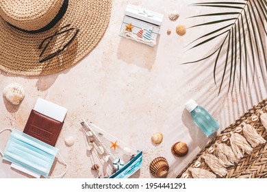 Travel flat lay with passport, clothes, beach accessories, mask and hands sanitizer. Safe travel during covid concept, top view - Powered by Shutterstock