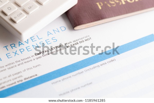 travel\
form with calculator and passport on the\
table