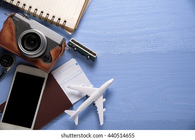Travel gear on blue wooden background. Travel concept - Powered by Shutterstock