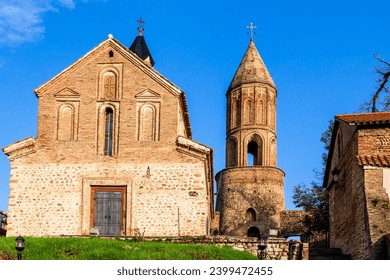 travel to Georgia - front view of Church of St George illuminated by sunset sun in old Sighnaghi town in Kakheti region in Georgia in autumn evening