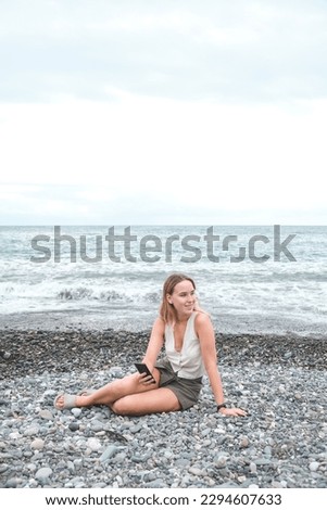 Similar – Young woman on the beach in the sun