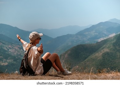 Travel. Girl travels through the mountains glamping, tents,waterfalls of wild nature. Unity, mental health, eco travel. Hiking in the mountains, van life vibes, travelling,good moments, digital detox - Powered by Shutterstock