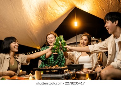 Travel Group of Diverse People Enjoy Camping Tent clinking beer bottles  with Friends, Hang Out Party campsite, Summer Travel and Recreation Concept. - Powered by Shutterstock