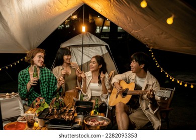 Travel Group of Diverse People Enjoy Camping Tent clinking beer bottles  with Friends, Hang Out Party campsite, Summer Travel and Recreation Concept. - Powered by Shutterstock