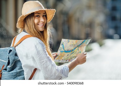 Travel Guide, Tourism In Europe, Woman Tourist With Map On The Street