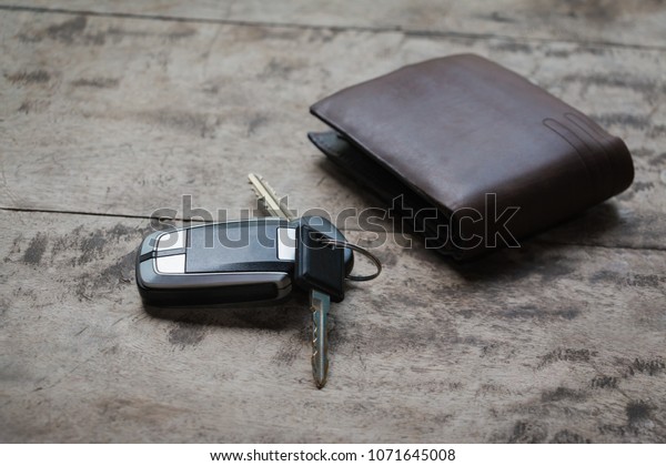 Travel Holiday with car keys and wallet on the wooden\
table. copy space. 
