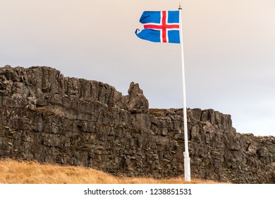 Travel  - Iceland Trip. Iceland Flag With Þingvellir View In The Background