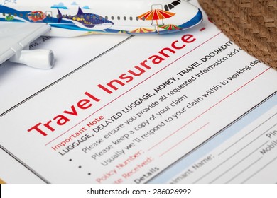 Travel Insurance Claim Application Form And Hat With Eyeglass On Brown Envelope, Business Insurance And Risk Concept; Document And Plane Is Mock-up