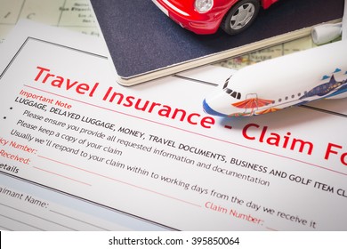 Travel Insurance Claim Application Form On Table, Business And Risk Concept; Document,car And Plane Is Mock-up