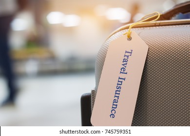 Travel Insurance Tag On Suitcase Holder With Tag Tied Letters Enjoyable Your Trip On Bag. Travel Insurance Is Intended Cover Medical Expenses, Cover Lost Luggage, Flight Cancellation Or Accident.