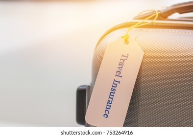 Travel Insurance Tag On Suitcase Holder With Tag Tied Letters Enjoyable Your Trip On Bag. Travel Insurance Is Intended Cover Medical Expenses, Cover Lost Luggage, Flight Cancellation Or Accident.