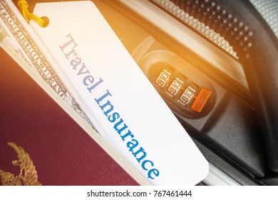 Travel Insurance Tag On Suitcase Near Numeric Combination Lock,passport And US Dollar. Travel Insurance Is Intended Cover Medical Expenses,cover Lost Luggage Flight Cancellation Or Accident