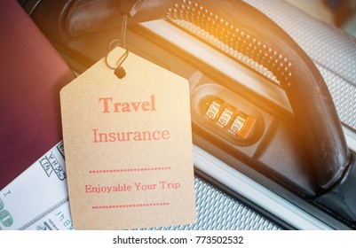 Travel Insurance Tag On Suitcase Near Numeric Combination Lock, Passport And US Dollar. Travel Insurance Is Intended Cover Medical Expenses,cover Lost Luggage Flight Cancellation Or Accident