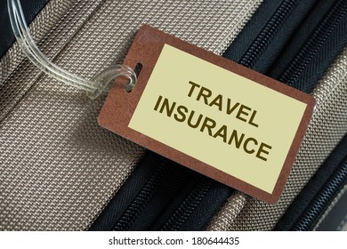 Travel Insurance Tag Tied To A Luggage