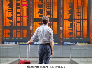 travel with international flight, person passenger waiting in airport departure terminal - Shutterstock ID 1374986876