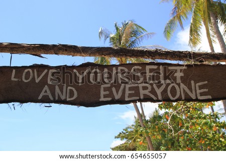Travel to island Koh Lanta, Thailand. An inscription (Love yourself and everyone) on the wooden abandoned hut.