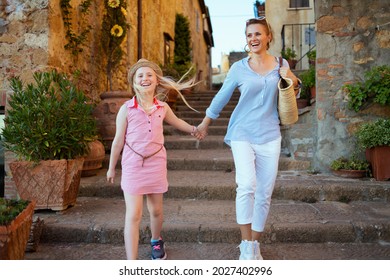 Travel In Italy. Happy Young Mother And Daughter Tourists In Tuscany, Italy Having Excursion In Pienza.