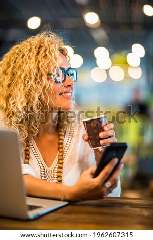 Travel job and smart working concept lifestyle with  young adult pretty woman use phone and laptopcomputer with roaming connection and free wifi airport gate bar cafe