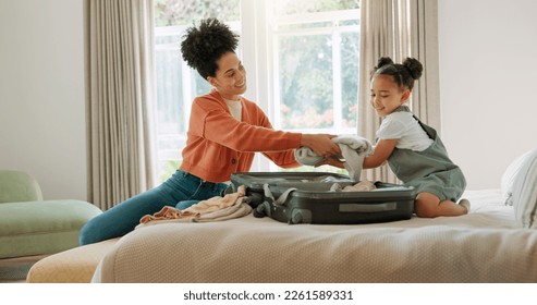 Travel, luggage and mom packing with child in bedroom getting ready for trip. Helping hands, black family and young girl help mother pack clothes in suitcase for holiday, vacation and weekend away - Powered by Shutterstock