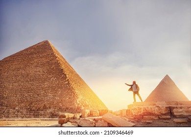 Travel man in hat stand background Egyptian pyramid sunset Giza Cairo, Egypt.