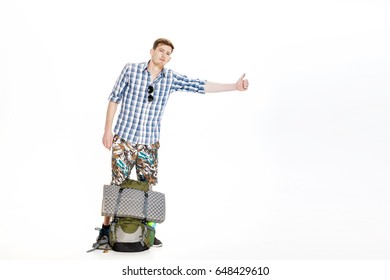 Travel Man Hitchhiking. Young Male Hitchhiker On White Background