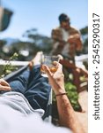 Travel, man and outdoor with glass in hand for drink, relax and weekend chill at luxury resort with friend. Person, whiskey and rest on hammock for summer vacation, holiday and peace on trip to Bali