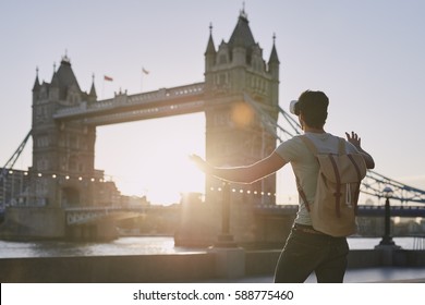 Travel Man Wearing Vr Headset Augmented Virtual 3d Reality Environment Concept At Tower Bridge London Landmark