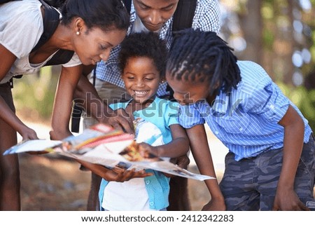 Travel, map and children with parents in a forest for location, direction or search outdoor together. Paper, navigation or black family reading hiking guide for woods trekking, adventure or discovery